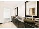 Modern bathroom with two stone vessel sinks and dark vanity at 2 Cherry Hills Farm Dr, Cherry Hills Village, CO 80113