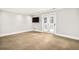 Simple bedroom with French doors leading to a balcony at 2 Cherry Hills Farm Dr, Cherry Hills Village, CO 80113