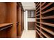 Large walk-in closet with ample shelving and hanging space at 2 Cherry Hills Farm Dr, Cherry Hills Village, CO 80113