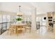 Open concept dining area with modern light fixture at 2 Cherry Hills Farm Dr, Cherry Hills Village, CO 80113