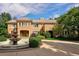 Grand two-story home with circular driveway and fountain at 2 Cherry Hills Farm Dr, Cherry Hills Village, CO 80113