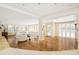 Spacious living room with hardwood floors and ample natural light at 2 Cherry Hills Farm Dr, Cherry Hills Village, CO 80113