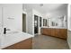 Spacious bathroom with double vanity, wood cabinets, and walk-in shower at 5629 Farrier Pt, Castle Rock, CO 80104
