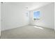 Bright bedroom with a cozy carpet and window offering natural light at 5629 Farrier Pt, Castle Rock, CO 80104