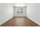 Spacious bedroom with wood floors, white walls, and ample natural light from double windows at 5629 Farrier Pt, Castle Rock, CO 80104