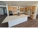 Modern kitchen featuring a large center island, stainless steel appliances, and ample cabinet space at 5629 Farrier Pt, Castle Rock, CO 80104