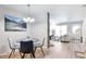Bright and inviting open-concept living and dining area with contemporary decor and ample natural light at 1011 Milo Cir # A, Lafayette, CO 80026