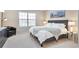 Relaxing main bedroom featuring plush carpeting, a large window, and stylish furnishings at 1011 Milo Cir # A, Lafayette, CO 80026