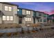 Modern townhome exterior with stone and blue accents at 16748 W 93Rd Pl, Arvada, CO 80007