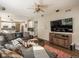 Open Gathering room with sectional sofa and view into kitchen at 6051 S Telluride Cir, Aurora, CO 80016