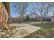 Large backyard features a patio and a privacy fence with mature trees and landscaping at 2050 S Lincoln St, Denver, CO 80210