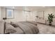 Spacious basement bedroom with carpet and an accent wall featuring decor and natural light at 2050 S Lincoln St, Denver, CO 80210
