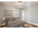 Serene bedroom with neutral tones, hardwood floors, and ample natural light with a minimalist design at 2050 S Lincoln St, Denver, CO 80210