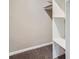 Spacious walk-in closet with built-in shelving providing ample storage space at 2050 S Lincoln St, Denver, CO 80210