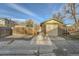 Detached garage with brick exterior and a tan garage door, set against a privacy fence at 2050 S Lincoln St, Denver, CO 80210