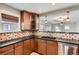 Stylish kitchen featuring updated cabinetry, sleek countertops, and mosaic backsplash details at 2050 S Lincoln St, Denver, CO 80210