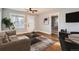 Cozy living room with hardwood floors and modern decor with an open view to the bedroom and dining area at 2050 S Lincoln St, Denver, CO 80210