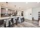 Modern kitchen featuring a large island, granite countertops, and sleek appliances at 17855 E 103Rd Ave, Commerce City, CO 80022