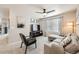 Spacious living room featuring comfortable seating, modern decor, and a large TV at 17855 E 103Rd Ave, Commerce City, CO 80022