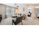 Living room showcasing stylish furniture and doorway view into the Primary bedroom at 17855 E 103Rd Ave, Commerce City, CO 80022