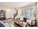 Cozy living room showcasing stylish furnishings and staircase access at 17855 E 103Rd Ave, Commerce City, CO 80022