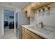 Well-equipped kitchen with stainless steel appliances and light wood cabinetry at 12133 Melody Dr # 103, Denver, CO 80234