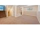 Spacious basement with built-in shelving and bathroom access at 456 Pluto Ct, Lone Tree, CO 80124