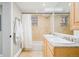 Updated bathroom with double vanity and shower/tub combo at 1165 N Pennsylvania St # 1B, Denver, CO 80203