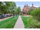 Building entrance with walkway and landscaping at 1165 N Pennsylvania St # 1B, Denver, CO 80203