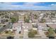 An elevated view shows a suburban neighborhood with mountain views in the distance at 19153 E 51St Ave, Denver, CO 80249