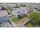Aerial view of a cozy backyard with a partial fence, green grass, and mature trees at 19153 E 51St Ave, Denver, CO 80249