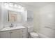 Clean bathroom with white cabinets, a combined tub and shower, and modern lighting at 19153 E 51St Ave, Denver, CO 80249