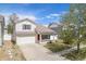 Charming two-story home with a well-maintained lawn and attached two-car garage at 19153 E 51St Ave, Denver, CO 80249