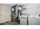 Functional laundry room with a washer, dryer, and utility closet for efficient home maintenance at 19153 E 51St Ave, Denver, CO 80249