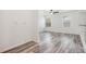Open living room featuring stylish flooring and two windows looking out into the neighborhood at 19153 E 51St Ave, Denver, CO 80249
