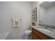 Clean bathroom with granite countertop, white tile, and updated fixtures at 1841 S Dunkirk St # 203, Aurora, CO 80017
