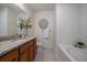 Clean bathroom with granite vanity, bathtub, and tiled shower at 1841 S Dunkirk St # 203, Aurora, CO 80017