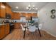 Modern kitchen features stainless steel appliances, granite countertops, and a dining area at 1841 S Dunkirk St # 203, Aurora, CO 80017