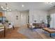 Open-concept living area with stylish decor and a view of the kitchen and dining area at 1841 S Dunkirk St # 203, Aurora, CO 80017