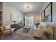 Cozy living room with natural light, modern decor, and comfortable seating arrangement at 1841 S Dunkirk St # 203, Aurora, CO 80017
