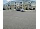 Apartment complex parking lot featuring reserved parking spots with two cars visible at 1841 S Dunkirk St # 203, Aurora, CO 80017