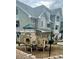 Community playground featuring a green and tan climbing structure, perfect for  at 1841 S Dunkirk St # 203, Aurora, CO 80017