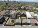 City skyline view of neighborhood with cozy houses with green lawns, fences, and surrounding landscape at 2530 N Franklin St, Denver, CO 80205