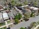 An aerial view captures the neighborhood with tree-lined streets, highlighting the charming homes and community layout at 2530 N Franklin St, Denver, CO 80205