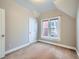 Cozy room features natural light from the window, neutral paint, white trim and carpeted floors at 2530 N Franklin St, Denver, CO 80205