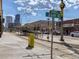 View of 26th Street with train and buildings under blue skies and clouds at 2530 N Franklin St, Denver, CO 80205