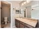 Bathroom featuring a vanity, large mirror, toilet and walk-in shower at 18984 E Kent Cir, Aurora, CO 80013