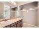 Bathroom featuring tile floors, extended vanity with large closet space at 18984 E Kent Cir, Aurora, CO 80013