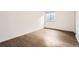 Bedroom features wood-look floors and a window with blinds at 18984 E Kent Cir, Aurora, CO 80013