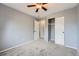 Carpeted bedroom offering closet space and a ceiling fan at 18984 E Kent Cir, Aurora, CO 80013